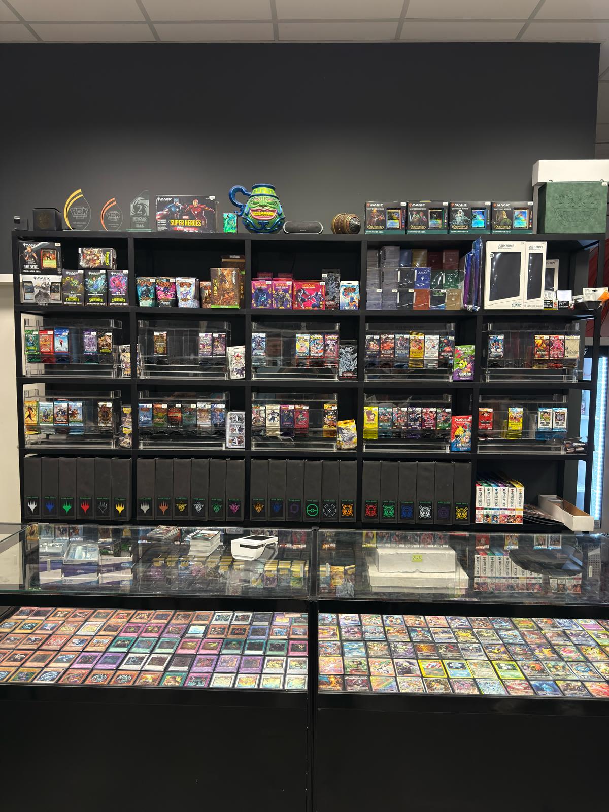 Shop shelf with boosters, displays and accessoires at Mana Games